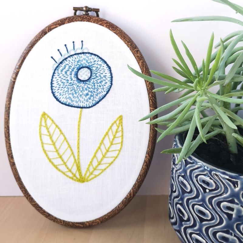 Flower embroidery design. blue modern flower embroidery in a hoop