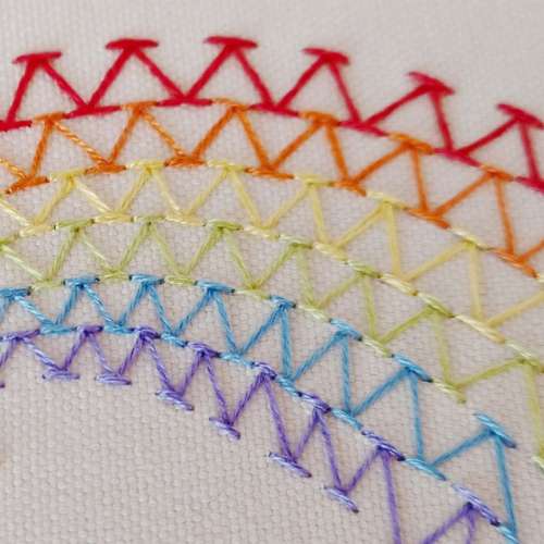 Chevron stitch rows embroidered with rainbow color threads