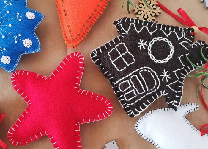 Handmade Christmas decorations from felt fabric of various shapes sizes and colors
