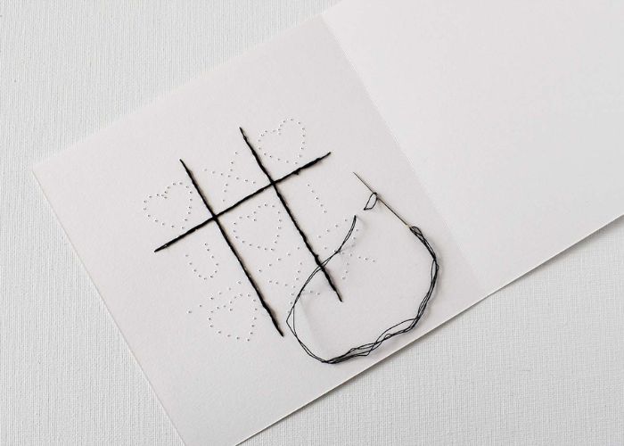 Folded thread method to start stitching on paper