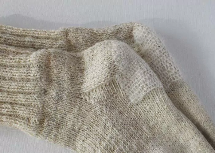 Socks mended with Scotch darning stitch: Mending knitwear