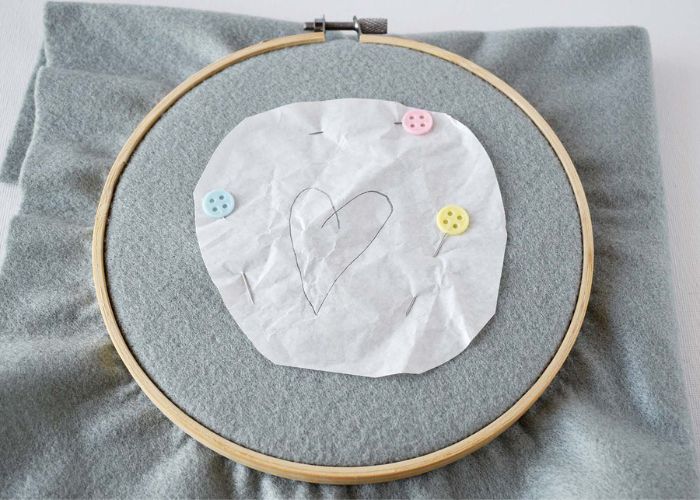 Pin tissue paper if the hoop is big