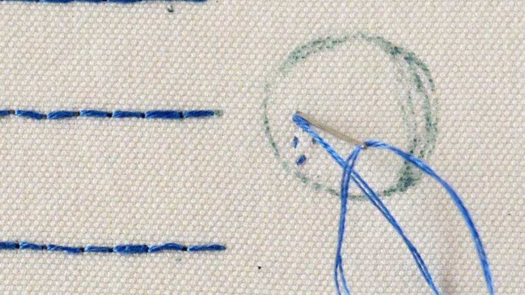End embroidering with holding stitch
