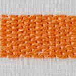 Brick stitch embroidery with orange pearl cotton on white fabric