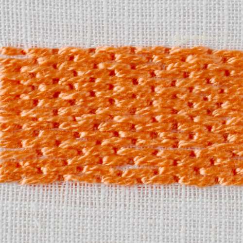Brick stitch embroidery with orange pearl cotton on white fabric