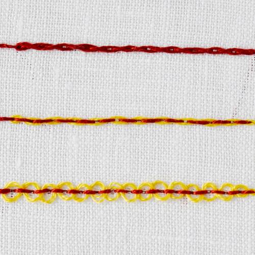Double threaded backstitch embroidered with yellow and red embroidery floss