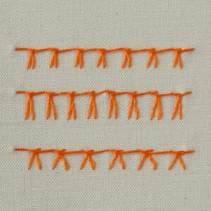 German knotted blanket stitch embroidered with orange thread - front side
