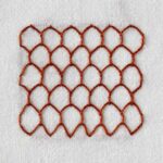 Honeycomb stitch embroidery with dark red thread on white fabric