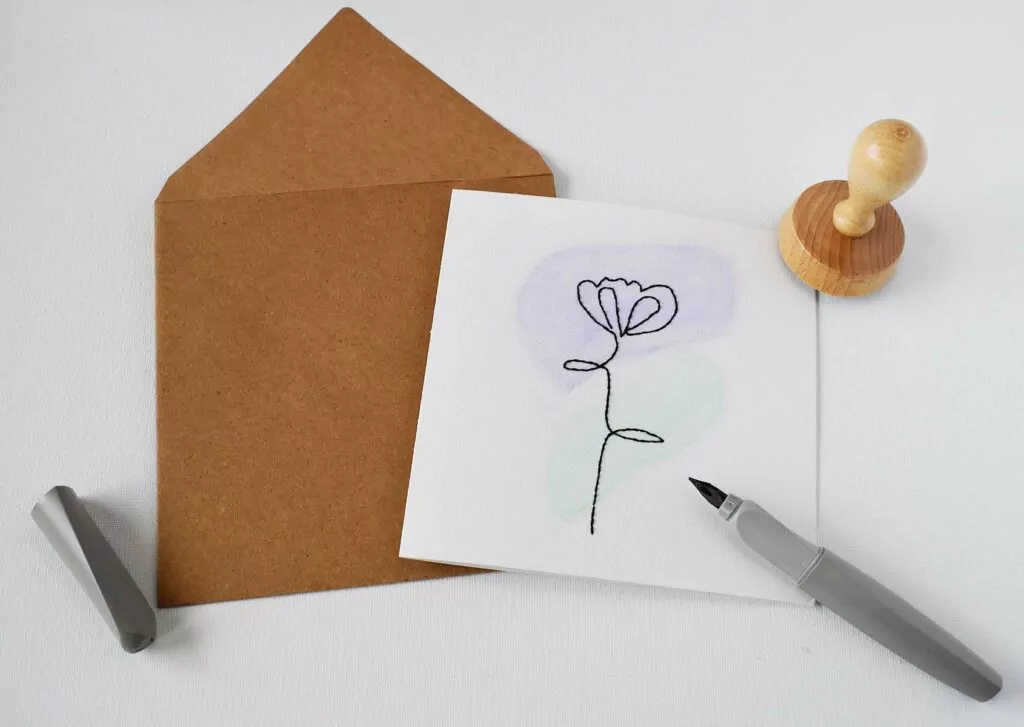 Practical Embroidery Contact page image letter with pens and stamp