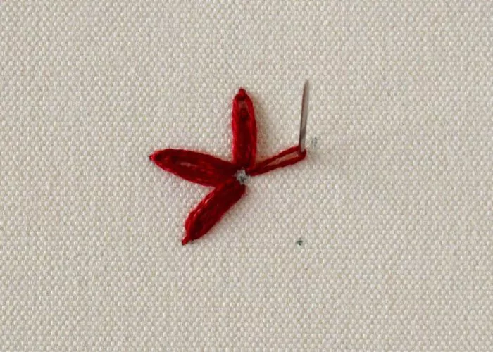 Red flower embroidery in progress