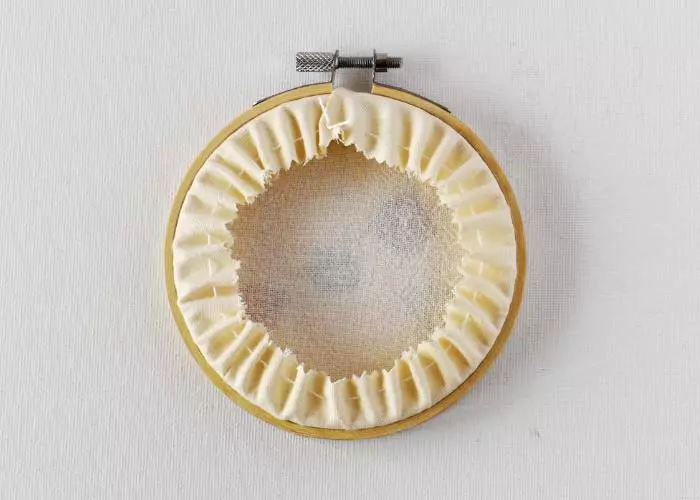 Hoop finished with running stitches and fabric