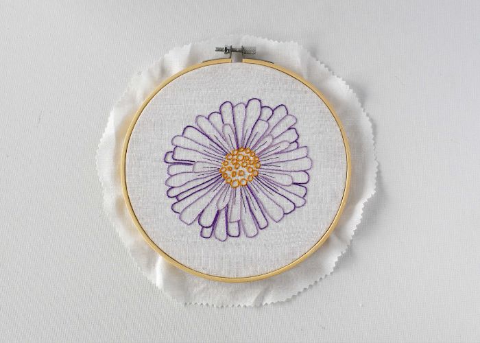 Purple flower embroidery with trimmed edge