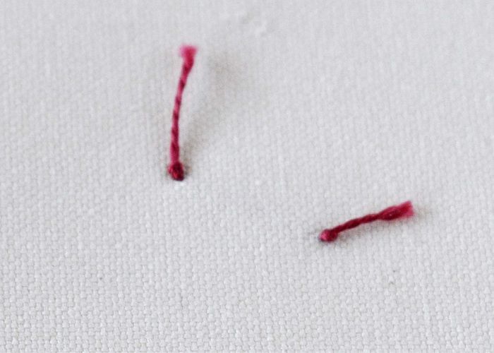 Straight stitch with red thread back side