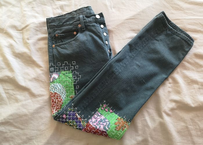 Colorfully mended jeans with patches and sashiko stitching