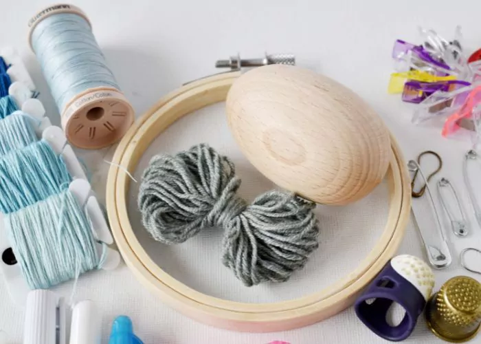 Mending tools and materials hoop egg and thread