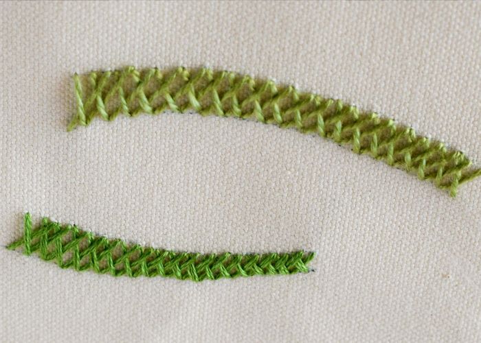 Basket stitch embroidery with green threads front view