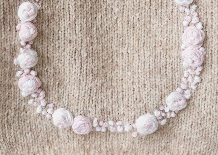 Floral embroidery on knitwear: Mending knitwear