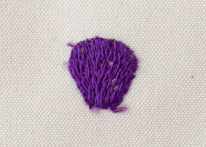 Long and Short stitch embroidery with purple threads back side