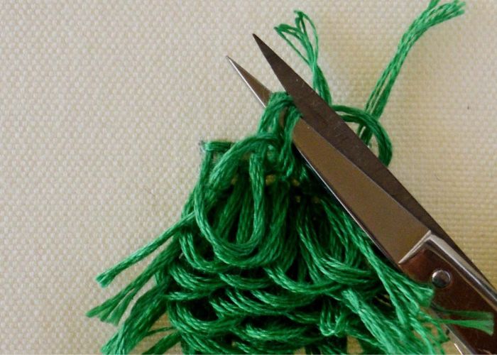 Cut the loops of Turkey rug knot stitch