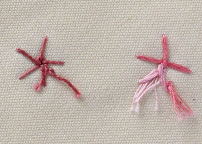Woven spider wheel stitch flowers pink pearl cotton and variegated floss, back side