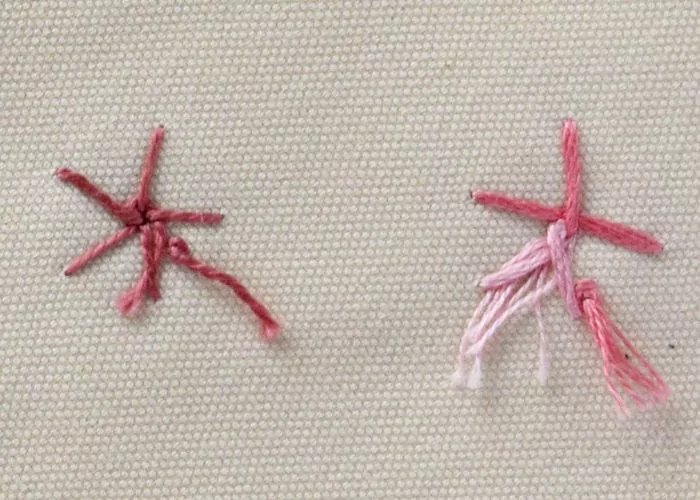 Woven spider wheel stitch flowers pink pearl cotton and variegated floss, back side