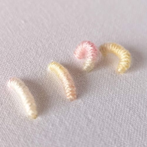 Bullion knot embroidery with light pink floss