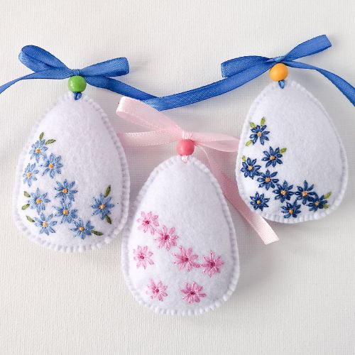 Easter eggs with daisy embroidery