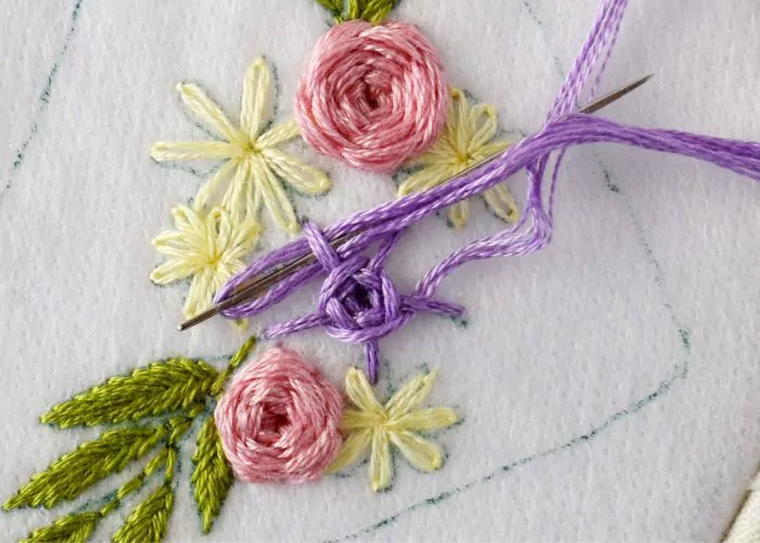 Purple woven wheel stitch flower embroidery