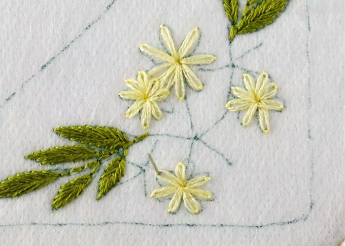 Small Daisies embroidered with light yellow thread