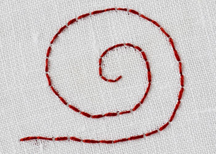 Backstitch embroidery with dark red floss