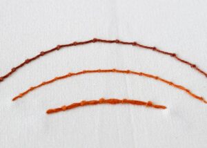 Coral Stitch embroidery. Brown pearl cotton and orange embroidery floss