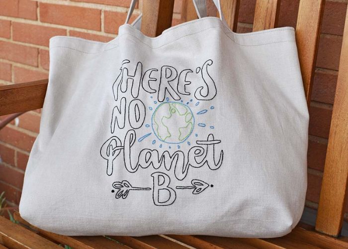 Sustainable shopper bag with no planet b embroidery