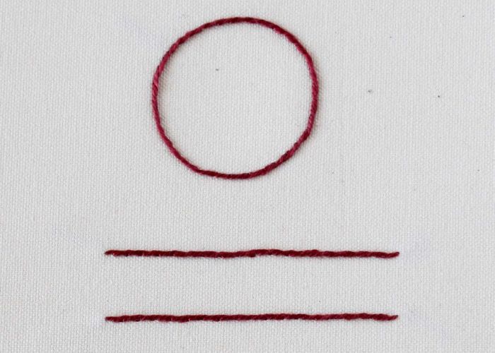 Outline embroidery stitch with dark red floss