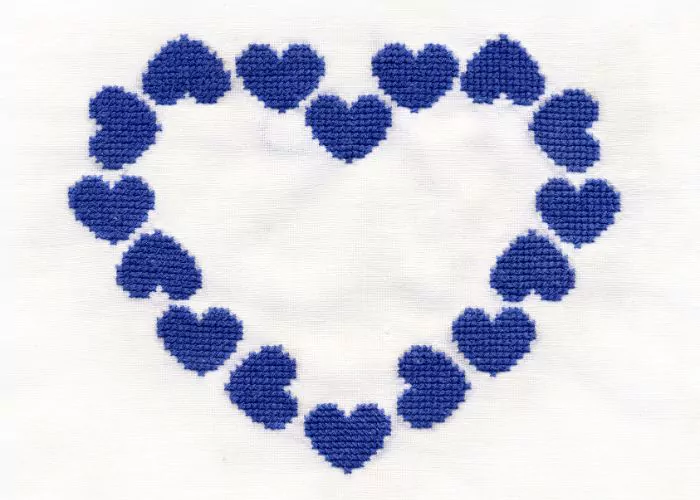 Cross stitch hearts outline negative space in the middle