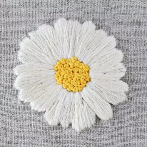 white Daisy wit filled center. Hand embroidery on linen