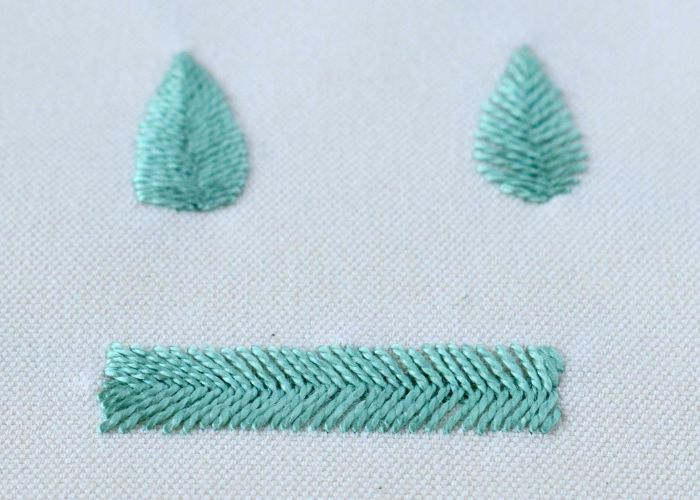 Fishbone stitch embroidery bar and leaves with green pearl cotton