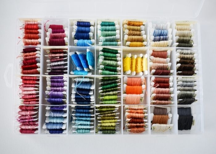 DMC embroidery floss on bobbins in the box