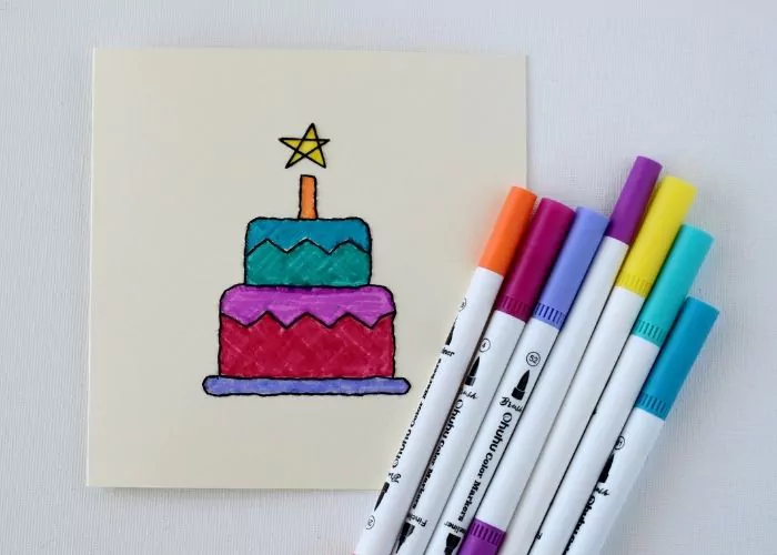 Colorful embroidered birthday card with a cake design