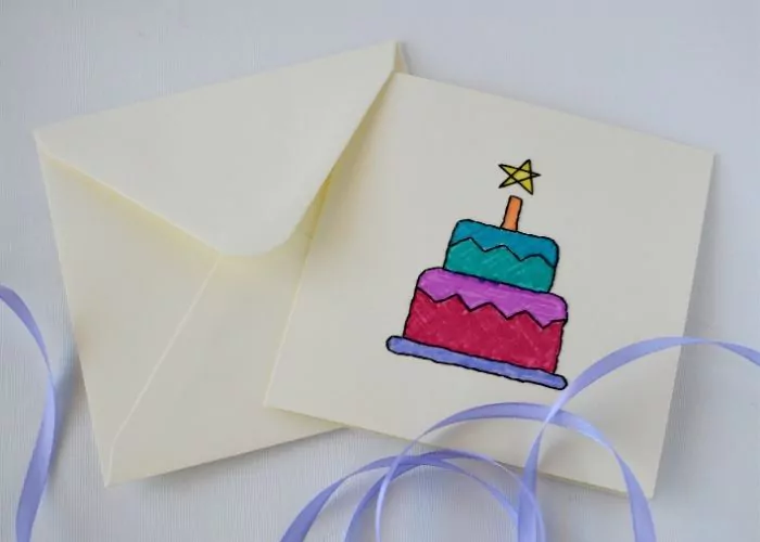 Hand embroidered birthday card with a cake design