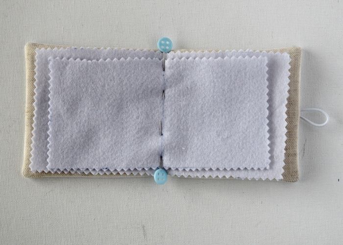 Add the pages to the embroidered needle book