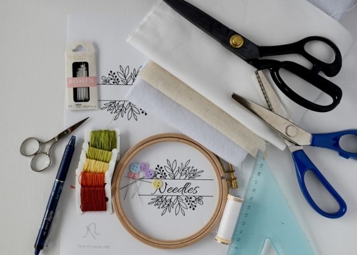 Tools and materials needed for embroidered needle book tutorial