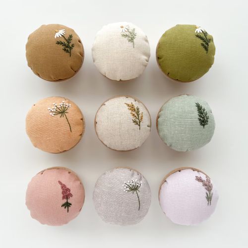 Hand embroidered pin cushions on Etsy