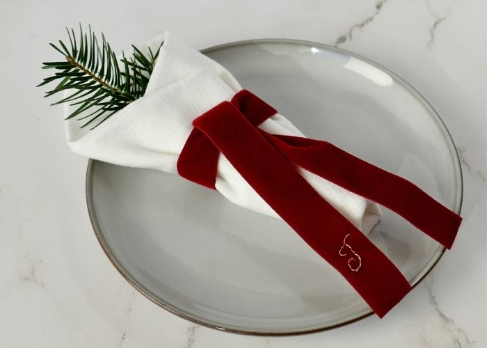 Tie the napkin with a monogrammed velvet ribbon