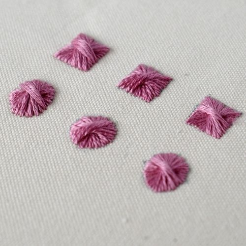 Rhodes Stitch embroidery sampler with pink thread