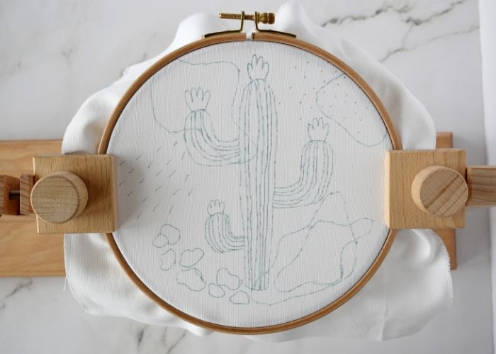 Hoop with a design ready to stitch in a hoop stand