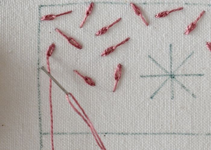 Filling with long tailed daisy stitch