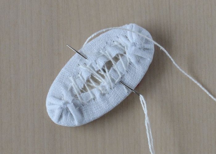 Sew the back of the pendant