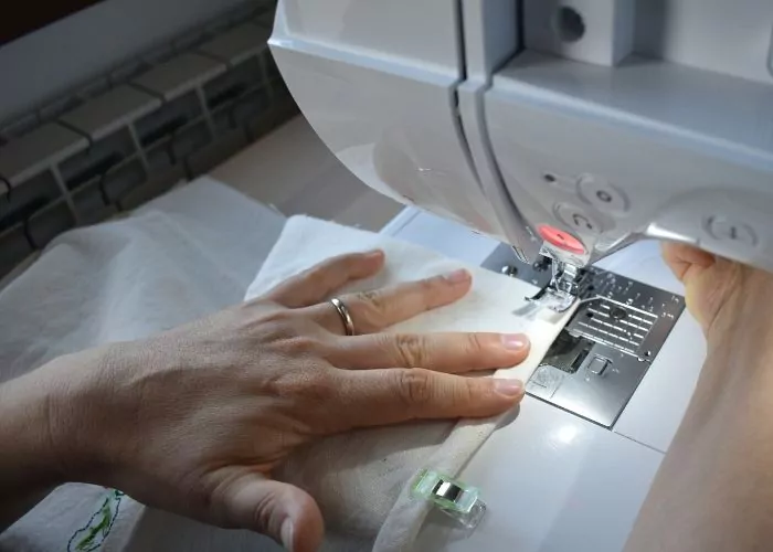 Sewing hand embroidered tea towels