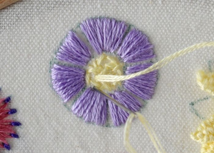Filling the center of the flower with seed stitch