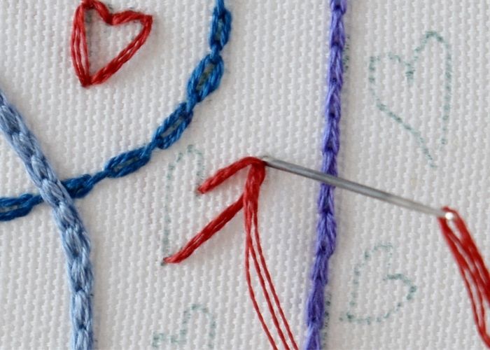 Anchor the loop at one side of the heart shape with a tiny anchoring stitch.